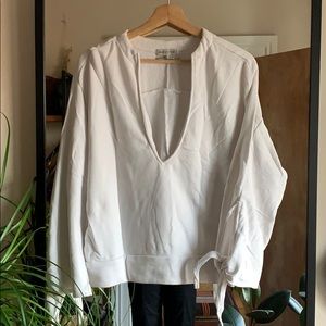 Cozy Urban Outfitters sweater with tie sleeves